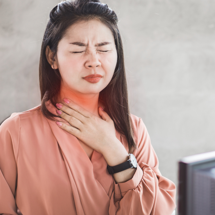 Female with a red throat indicating acid reflux, GORD or GERD.
